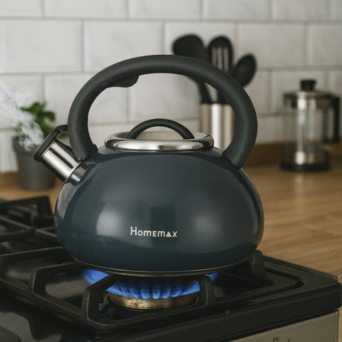 Black kettle with 'Homemax' branding on a burning gas stove